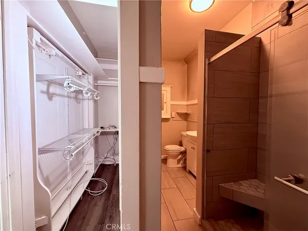 a bathroom with a shower and a sink