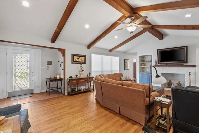a living room with furniture and a fireplace