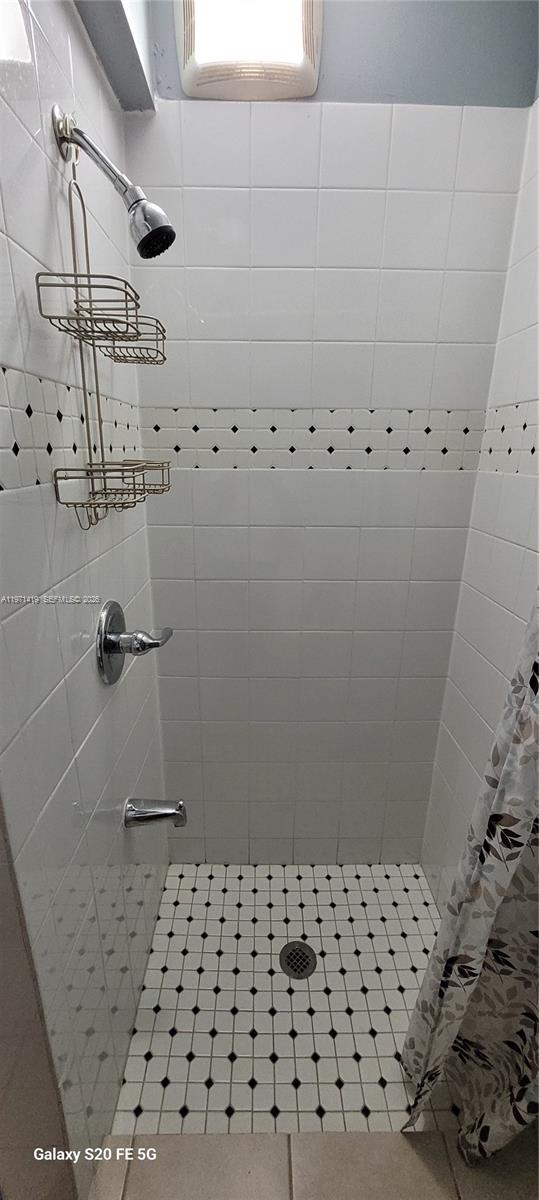 4036 Southwest 67th Terrace, Unit 5 Davie, FL 33314 - Photo 13 of 21 a bathroom with a shower