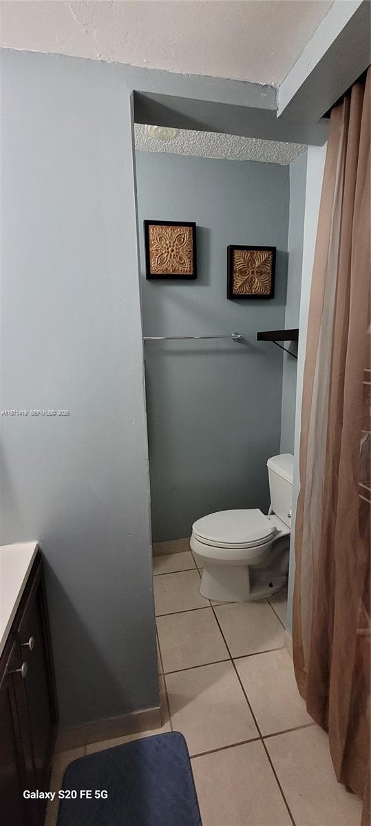 4036 Southwest 67th Terrace, Unit 5 Davie, FL 33314 - Photo 14 of 21 a toilet sitting in a bathroom next to a window