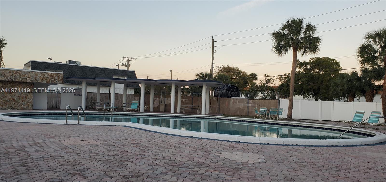 4036 Southwest 67th Terrace, Unit 5 Davie, FL 33314 - Photo 19 of 21 a view of a house with a backyard