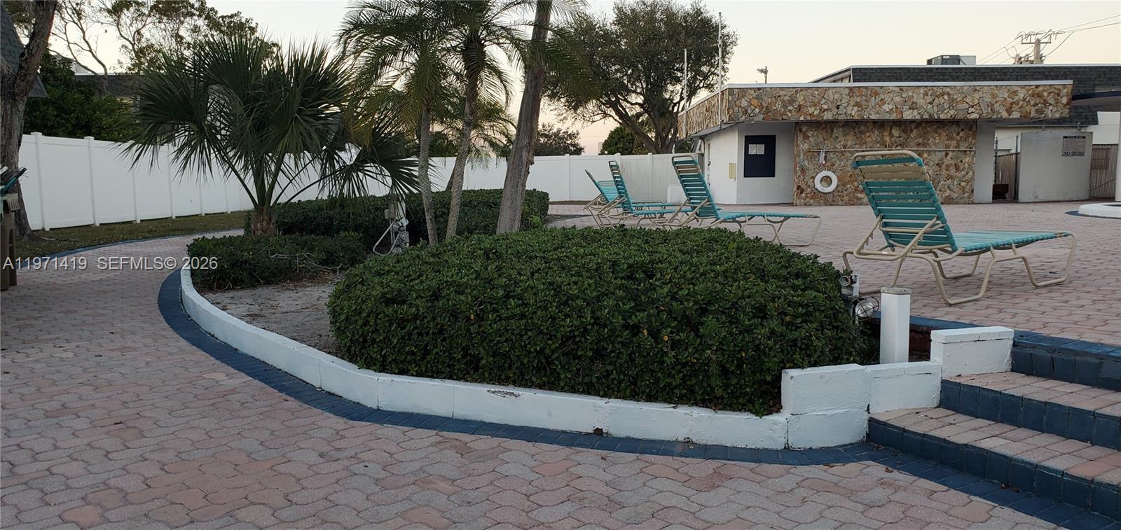 4036 Southwest 67th Terrace, Unit 5 Davie, FL 33314 - Photo 20 of 21 a front view of a house with a yard