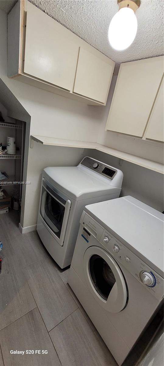 4036 Southwest 67th Terrace, Unit 5 Davie, FL 33314 - Photo 8 of 21 a utility room with dryer and washer