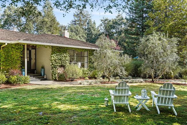 3324 Woodside Road Woodside, CA 94062 - Photo 27 of 60 a backyard of a house with table and chairs