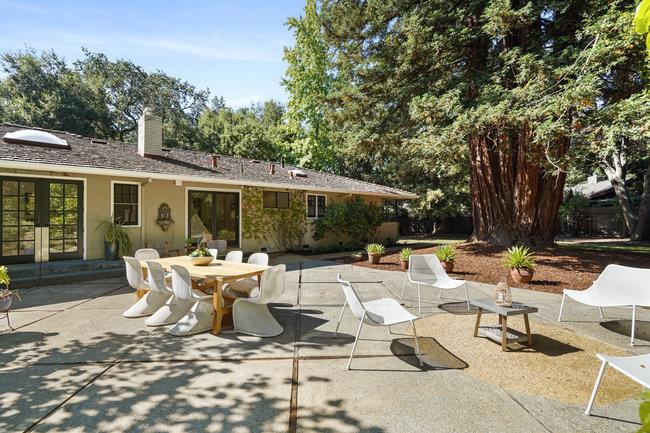 3324 Woodside Road Woodside, CA 94062 - Photo 28 of 60 a view of backyard of house with patio furniture and garden