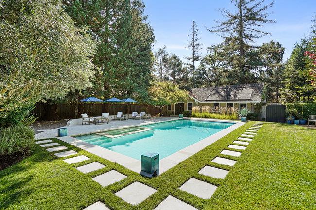 3324 Woodside Road Woodside, CA 94062 - Photo 38 of 60 a view of a swimming pool with a bench and trees