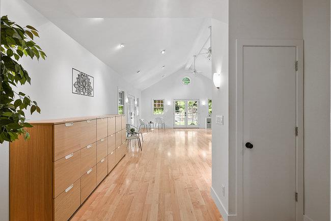 3324 Woodside Road Woodside, CA 94062 - Photo 44 of 60 a view of a hallway to a livingroom with wooden floor