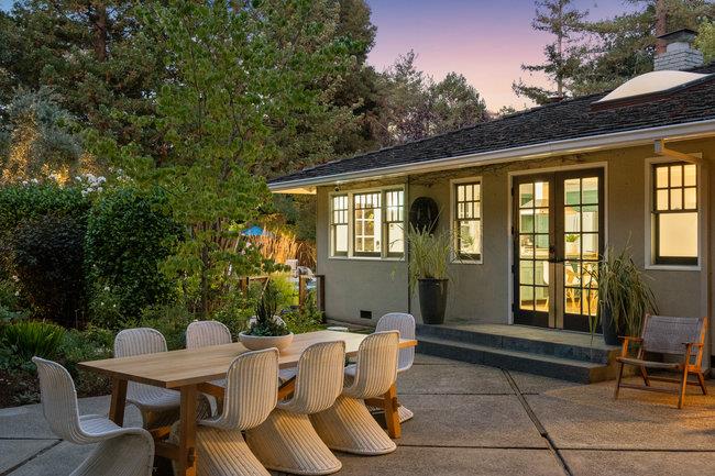 3324 Woodside Road Woodside, CA 94062 - Photo 56 of 60 a view of a patio with table and chairs and potted plants