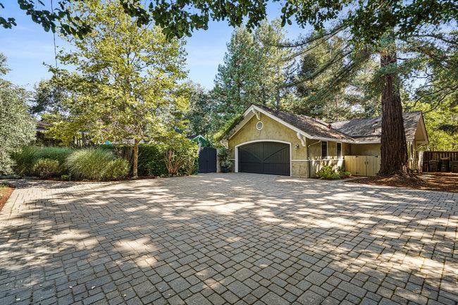 3324 Woodside Road Woodside, CA 94062 - Photo 6 of 60 a front view of a house with a yard and garage