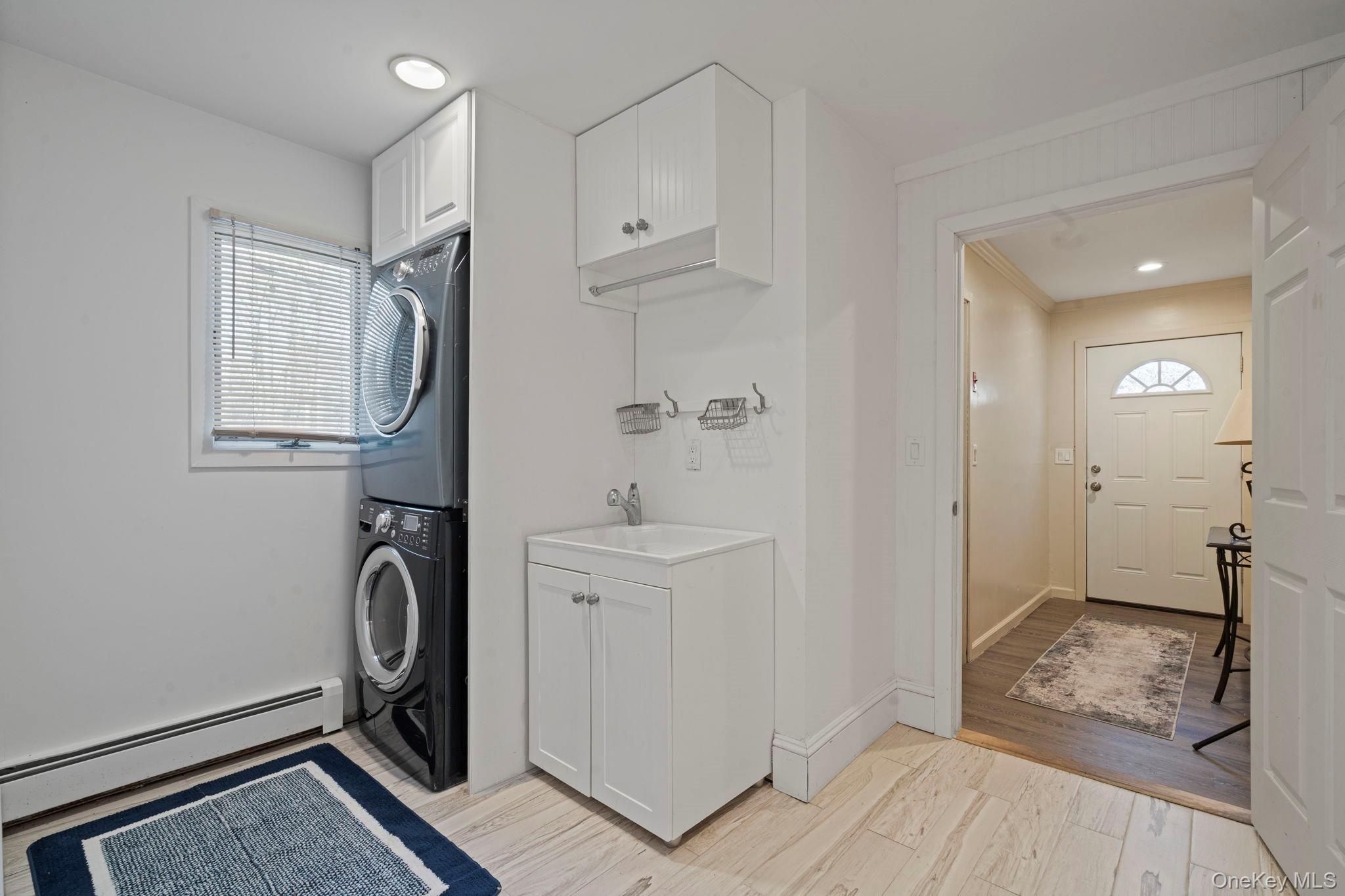 25 Cliff Road West Wading River, NY 11792 - Photo 19 of 35 a view of a storage & utility room with closet dryer