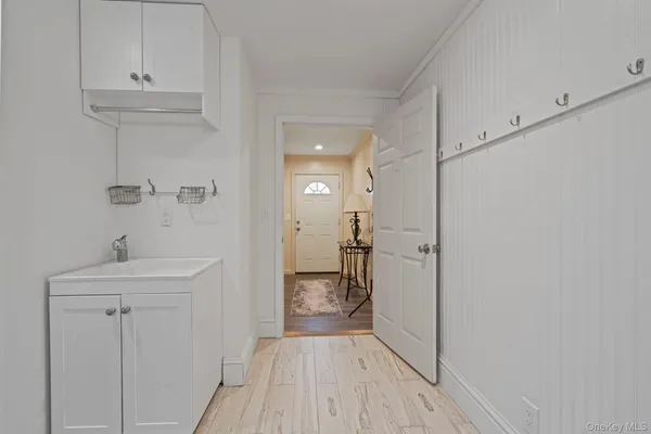 a view of a hallway with wooden floor