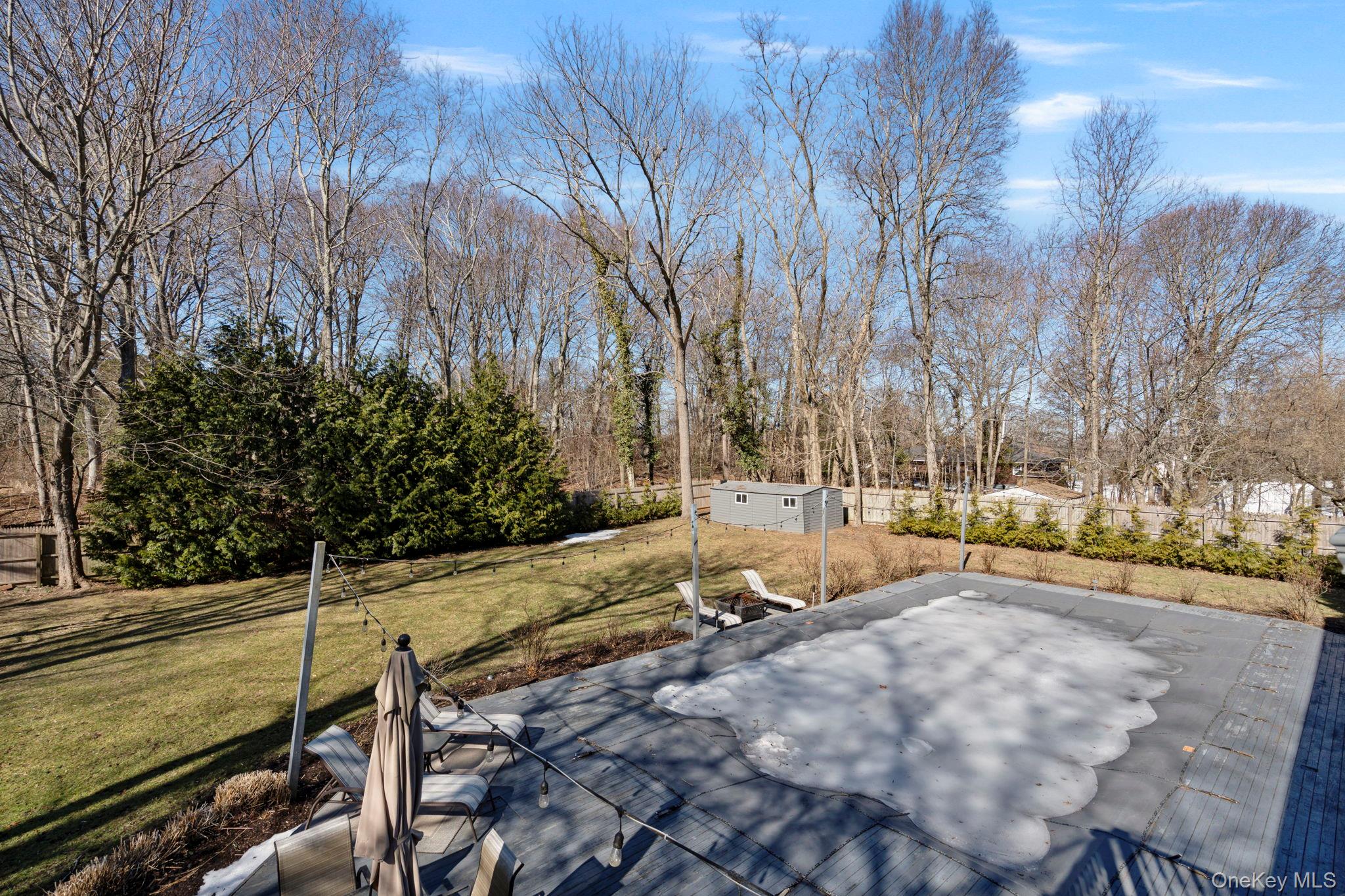 25 Cliff Road West Wading River, NY 11792 - Photo 26 of 35 a view of a yard with wooden fence