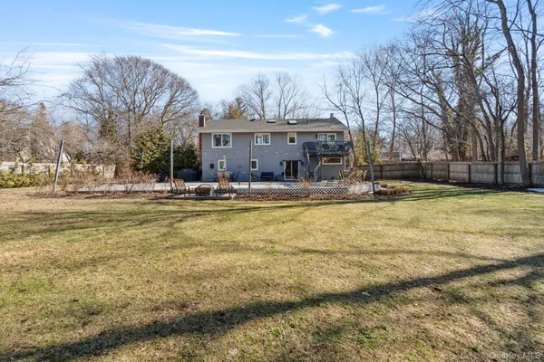 a view of a house with swimming pool and sitting area