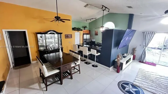 a view of living room with furniture and a chandelier