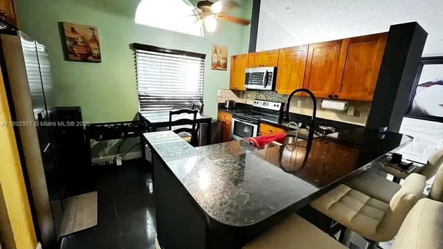 a room with furniture pool table and flat screen tv