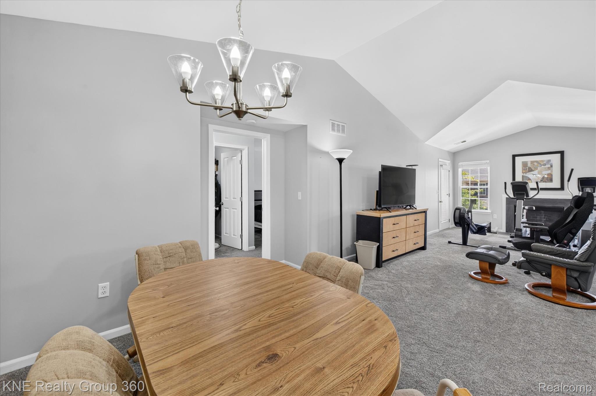 4077 Berkeley Avenue Canton, MI 48188 - Photo 17 of 32 Spacious room featuring vaulted ceilings, neutral gray walls, and plush gray carpeting
