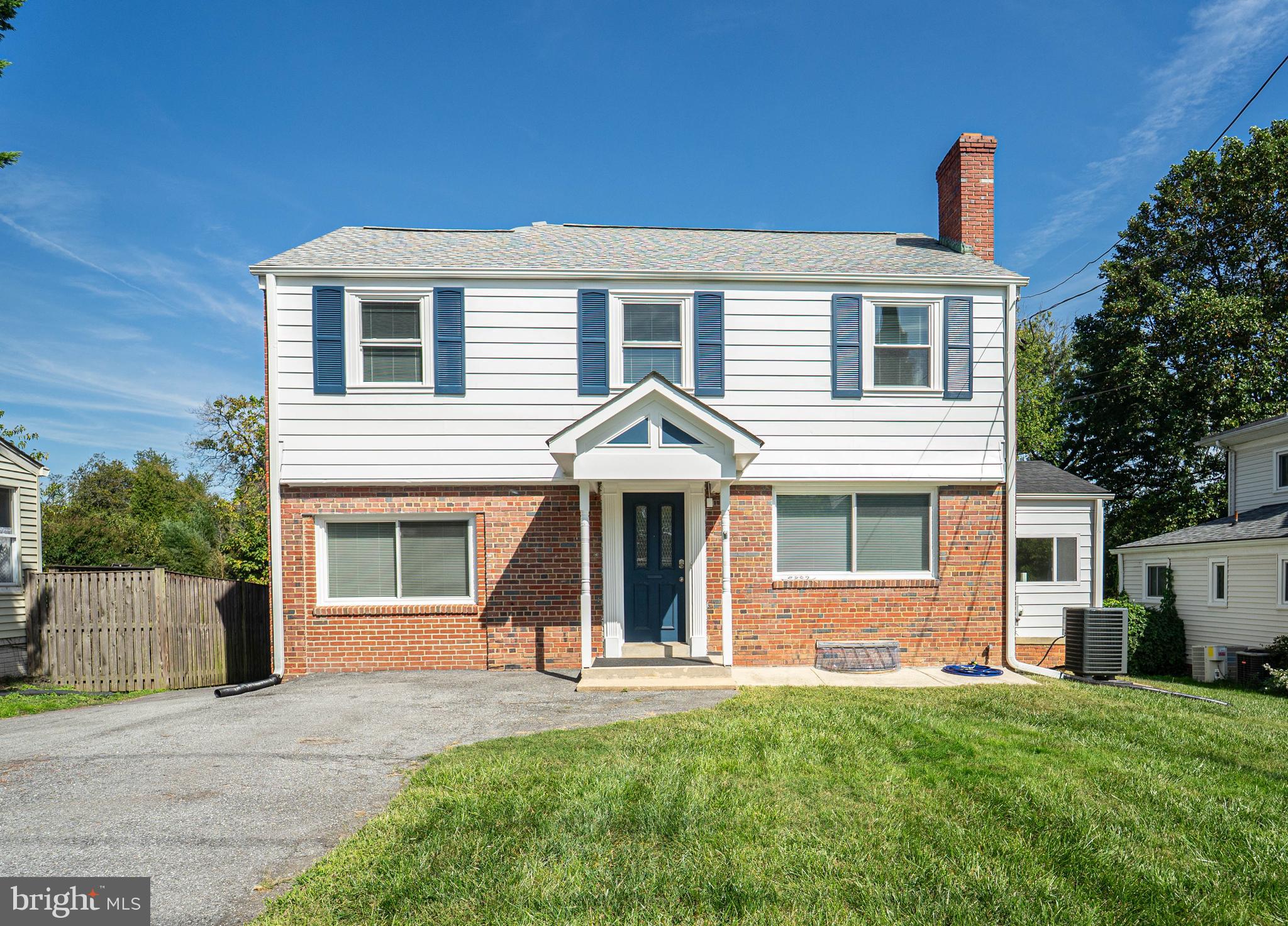8909 Georgia Avenue Silver Spring, MD 20910 - Photo 1 of 47 a front view of a house with a yard and garage