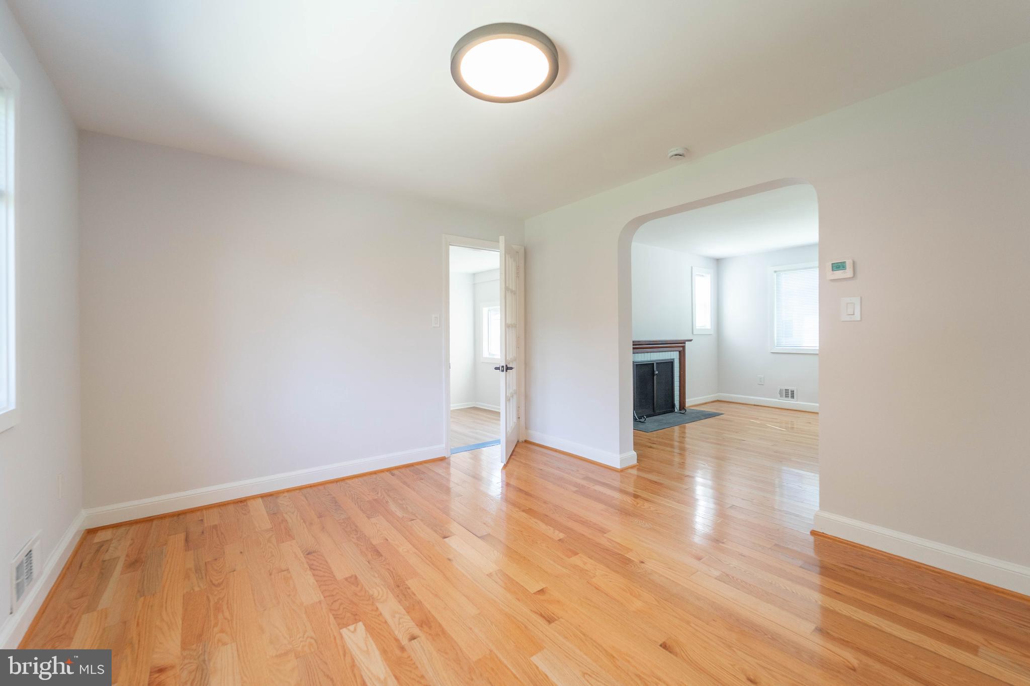 8909 Georgia Avenue Silver Spring, MD 20910 - Photo 12 of 47 a view of an empty room and wooden floor