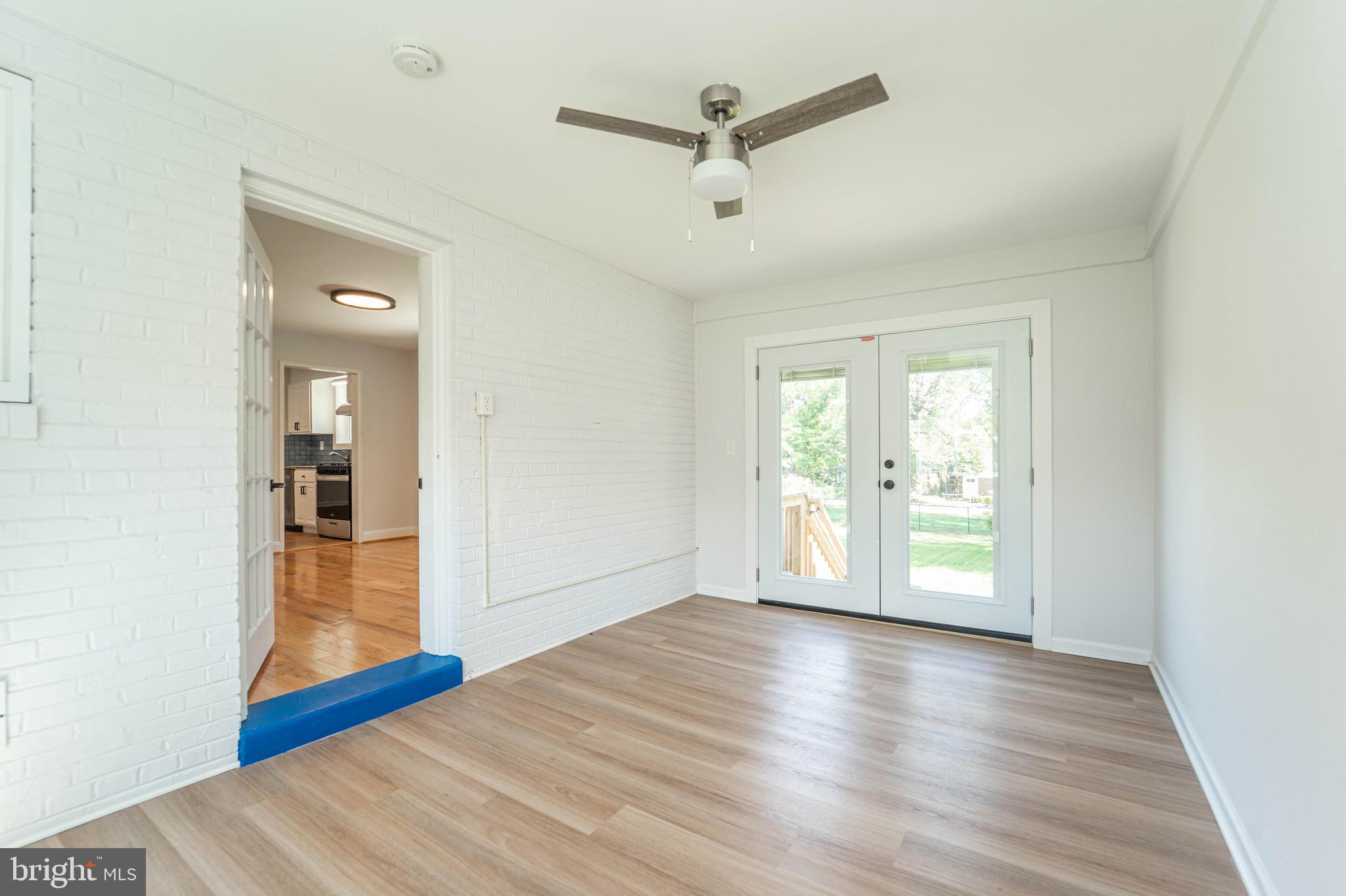 8909 Georgia Avenue Silver Spring, MD 20910 - Photo 15 of 47 wooden floor in an empty room with a window