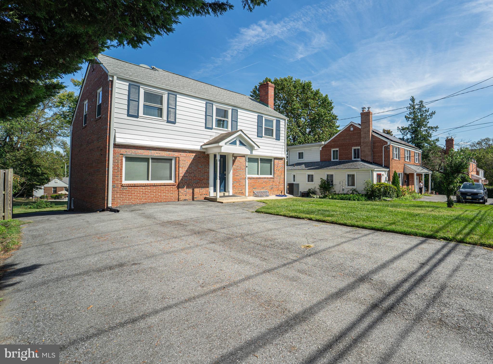 8909 Georgia Avenue Silver Spring, MD 20910 - Photo 2 of 47 a front view of a house with a yard
