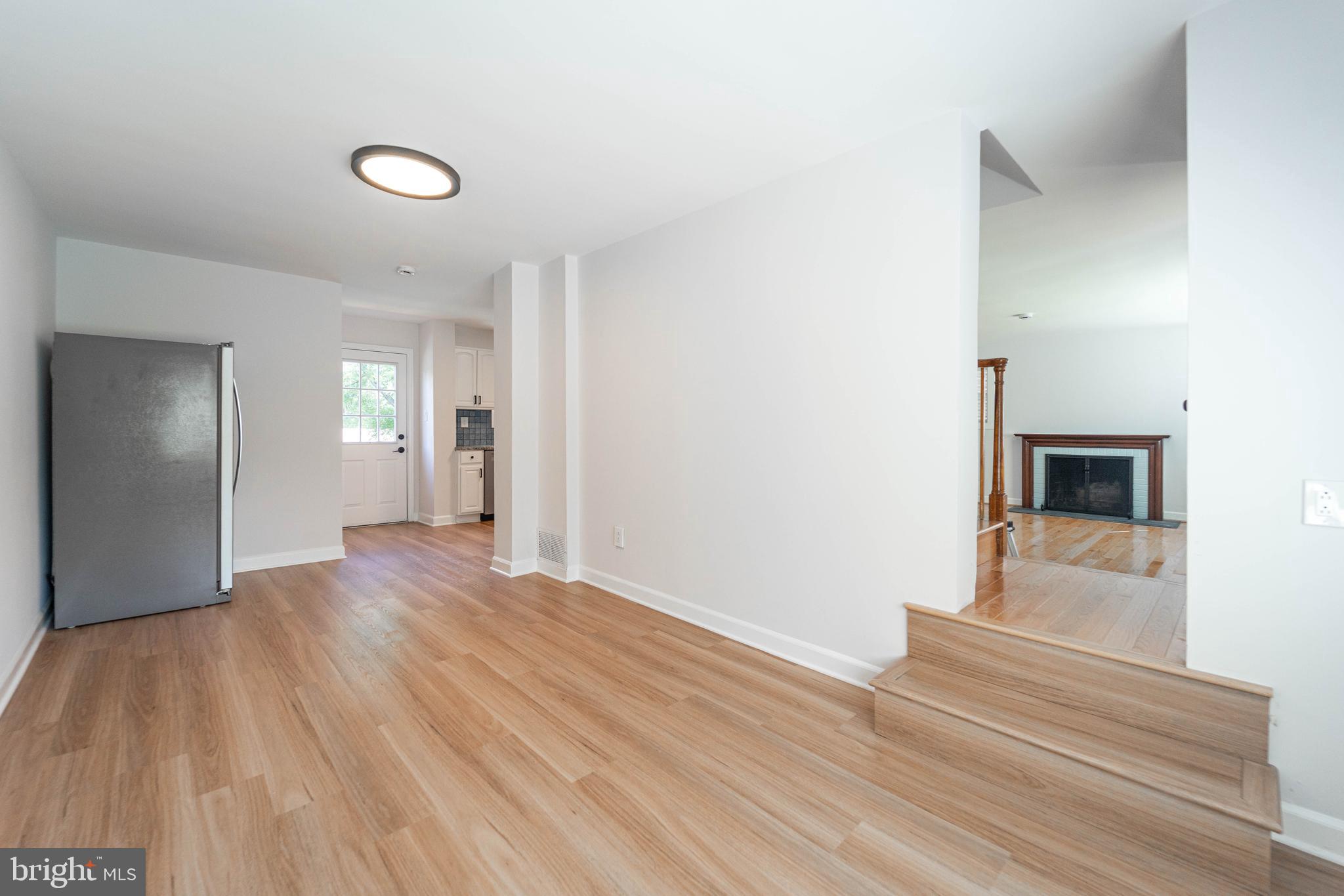 8909 Georgia Avenue Silver Spring, MD 20910 - Photo 24 of 47 a view of empty room with wooden floor and fan