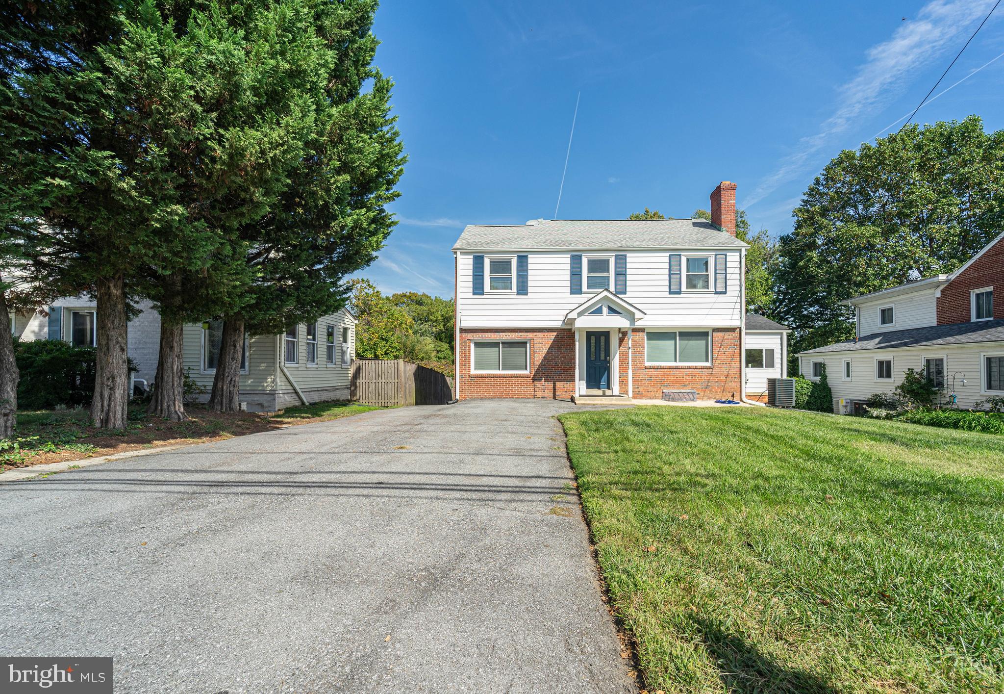 8909 Georgia Avenue Silver Spring, MD 20910 - Photo 3 of 47 a front view of a house with a yard