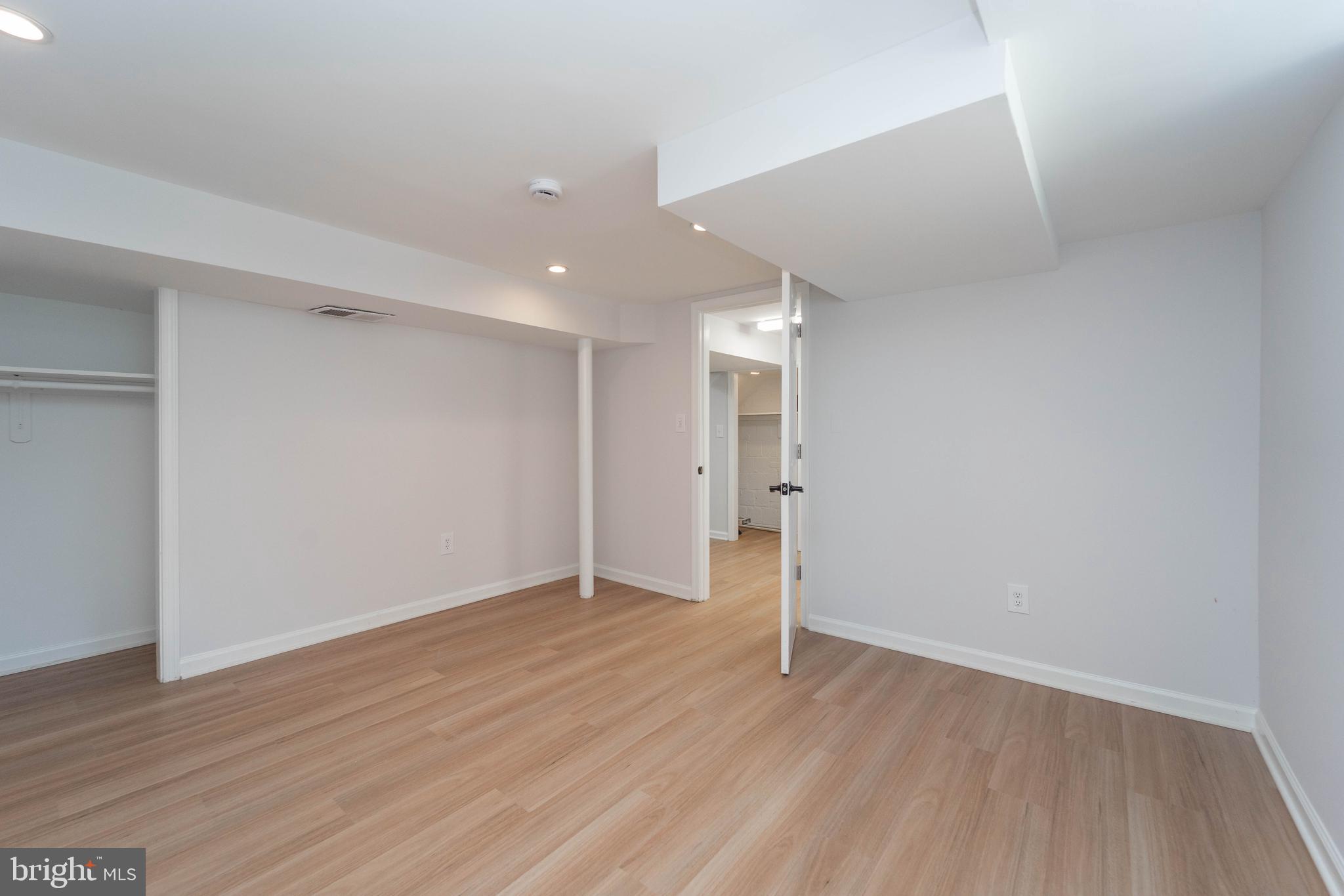 8909 Georgia Avenue Silver Spring, MD 20910 - Photo 35 of 47 a view of an empty room with wooden floor