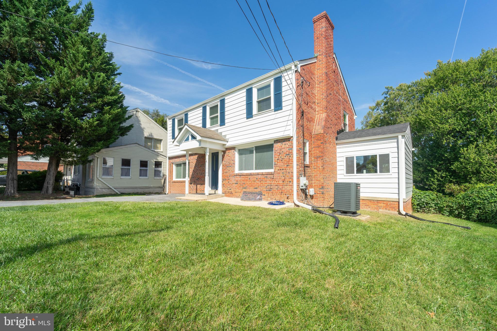 8909 Georgia Avenue Silver Spring, MD 20910 - Photo 4 of 47 a front view of a house with a garden