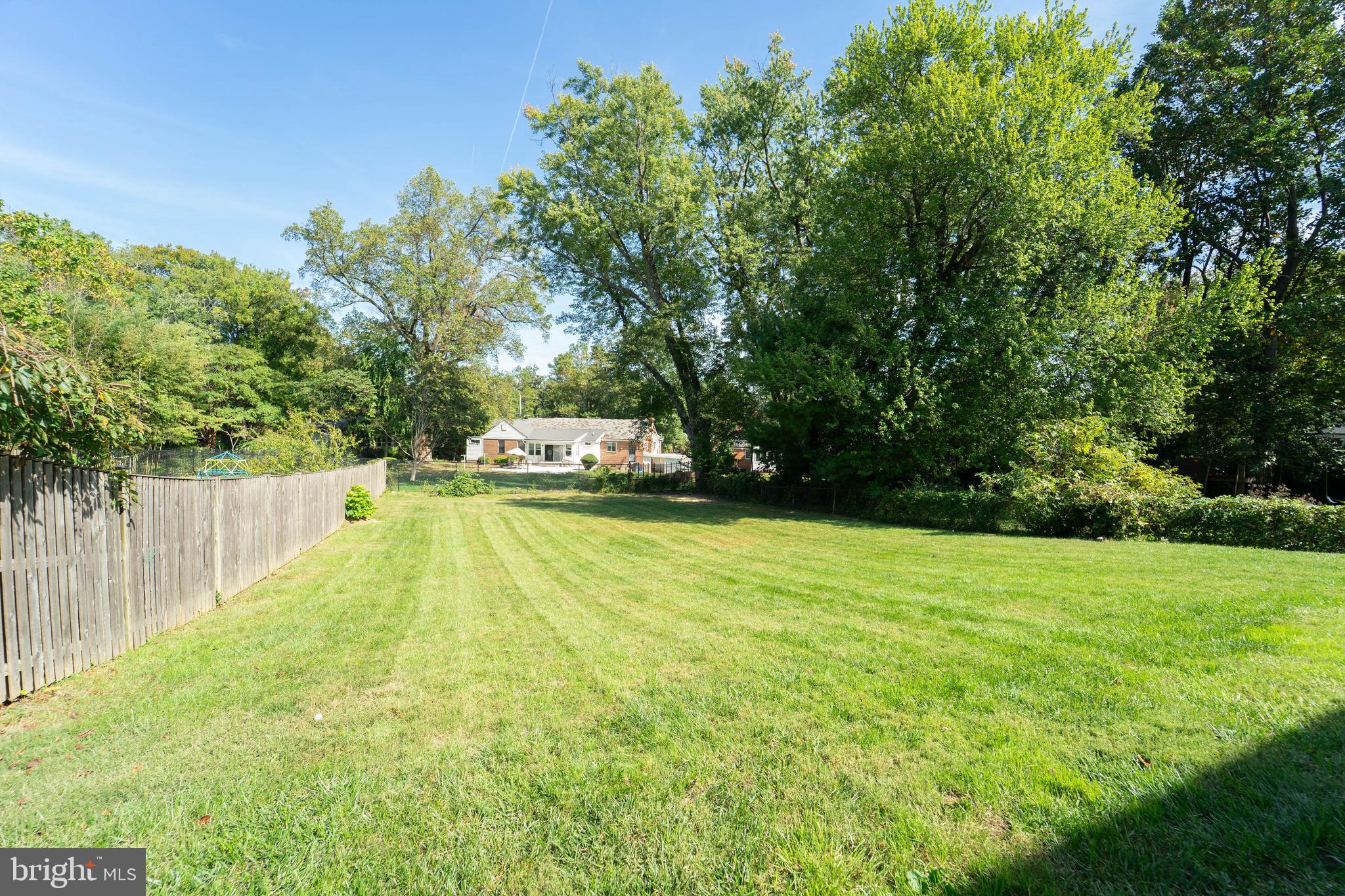 8909 Georgia Avenue Silver Spring, MD 20910 - Photo 6 of 47 a view of a swimming pool with a garden