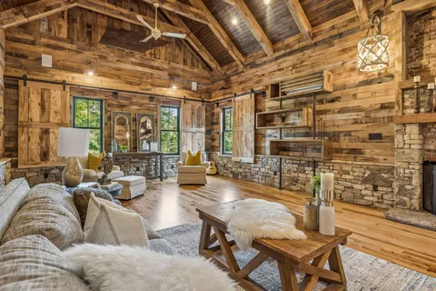 a dining room with wooden floor and furniture