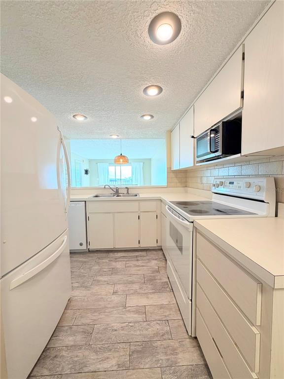 4550 Bay Boulevard, Unit 1224 Port Richey, FL 34668 - Photo 11 of 25 a view of a kitchen with a sink