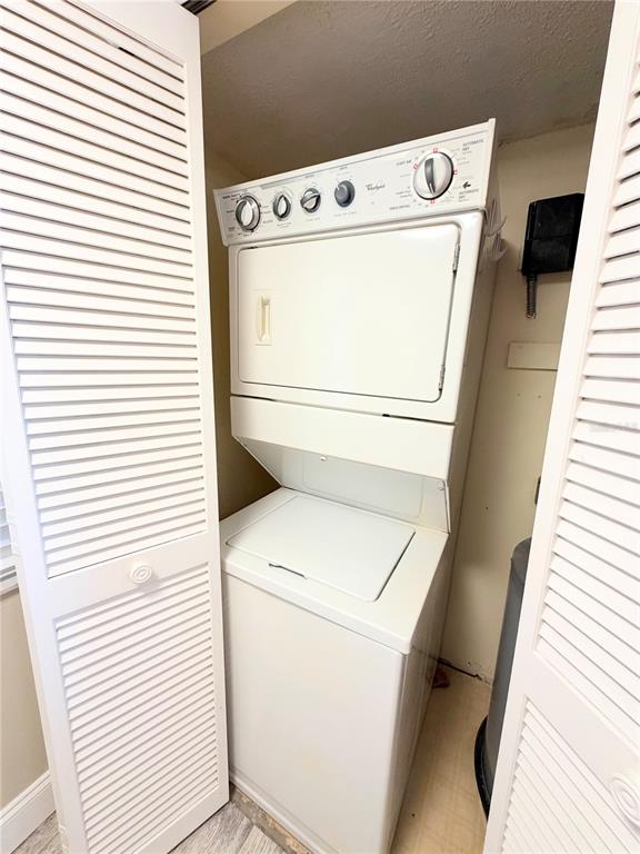 4550 Bay Boulevard, Unit 1224 Port Richey, FL 34668 - Photo 13 of 25 a utility room with dryer and washer