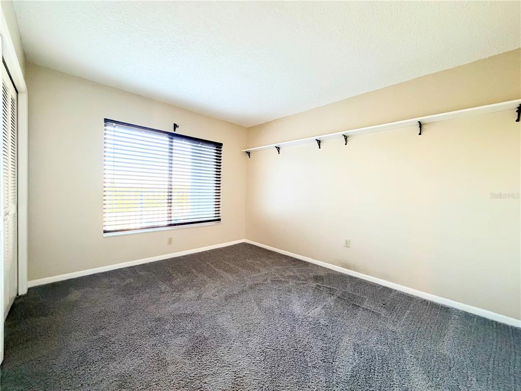 4550 Bay Boulevard, Unit 1224 Port Richey, FL 34668 - Photo 19 of 25 an empty room with windows