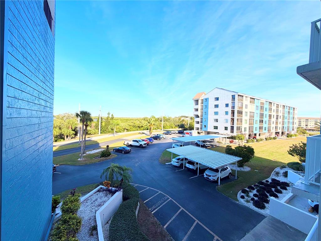 4550 Bay Boulevard, Unit 1224 Port Richey, FL 34668 - Photo 23 of 25 an outdoor space with patio furniture and ocean view