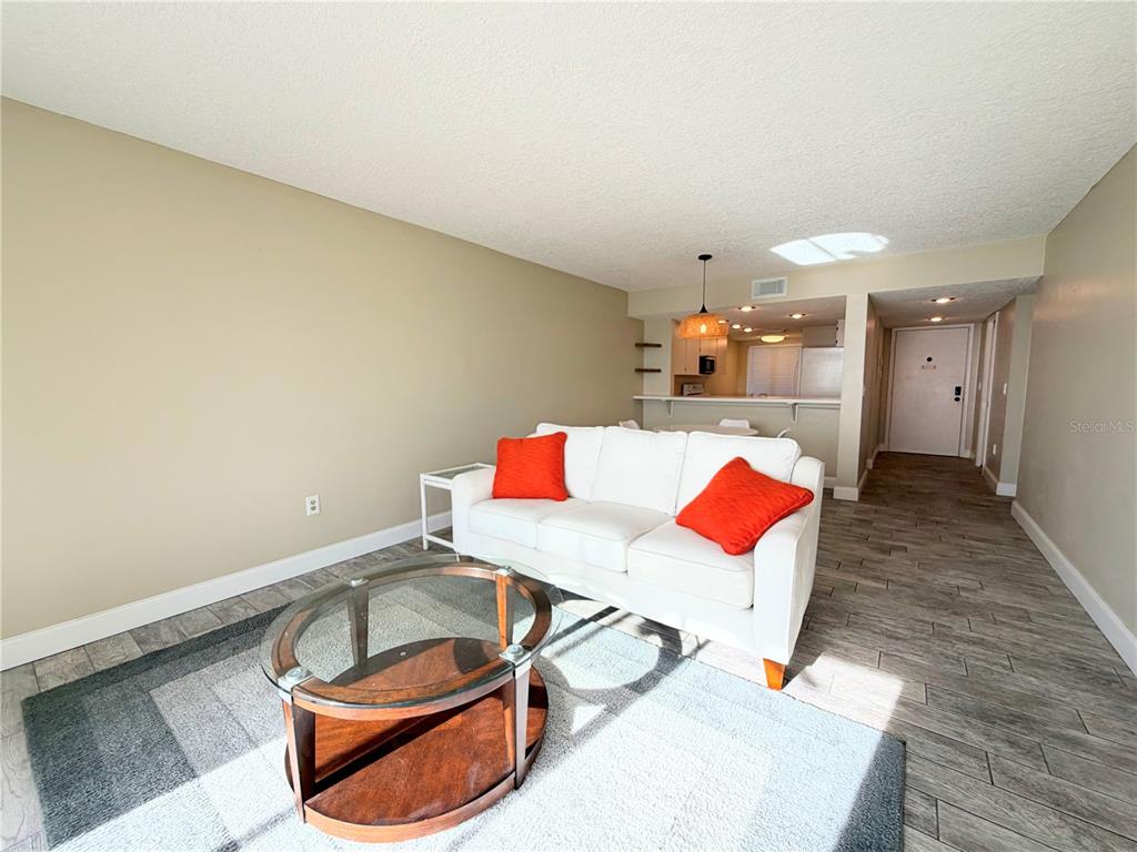 4550 Bay Boulevard, Unit 1224 Port Richey, FL 34668 - Photo 5 of 25 a living room with furniture and rug