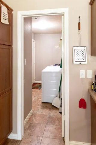 a room with a bench and cabinets