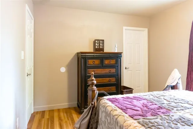 a bedroom with a bed and cabinets