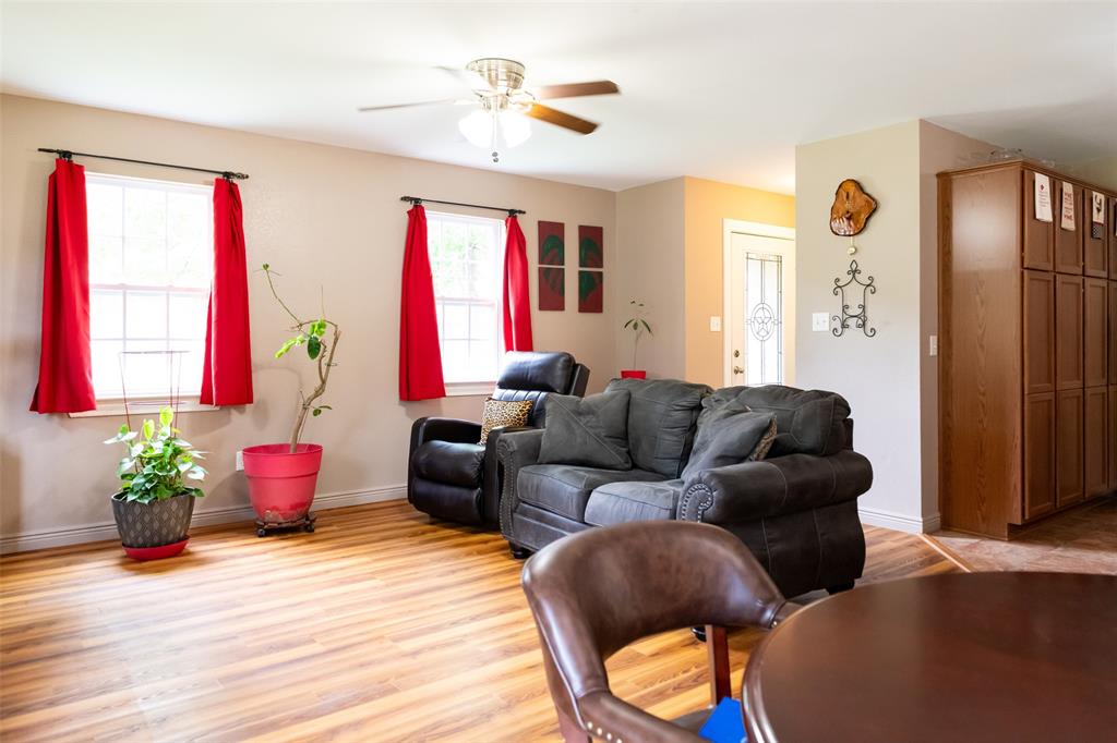 1019 Pine Street Bonham, TX 75418 - Photo 10 of 26 a living room with furniture chess board and a window