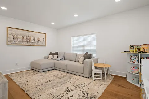 a living room with furniture and a table