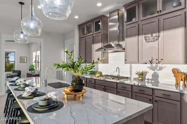 a living room with fireplace furniture and a large window