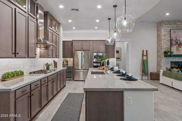 a view of a dining room with furniture wooden floor and chandelier