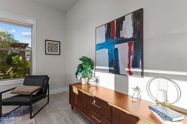 a view of a room with wooden floor and windows