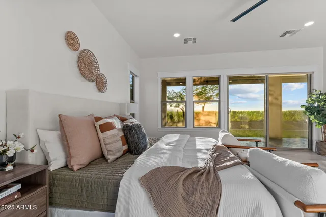a view of a swimming pool with a patio and a yard