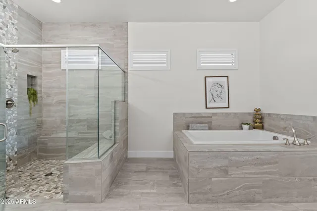 a view of house in front of a big yard with large trees