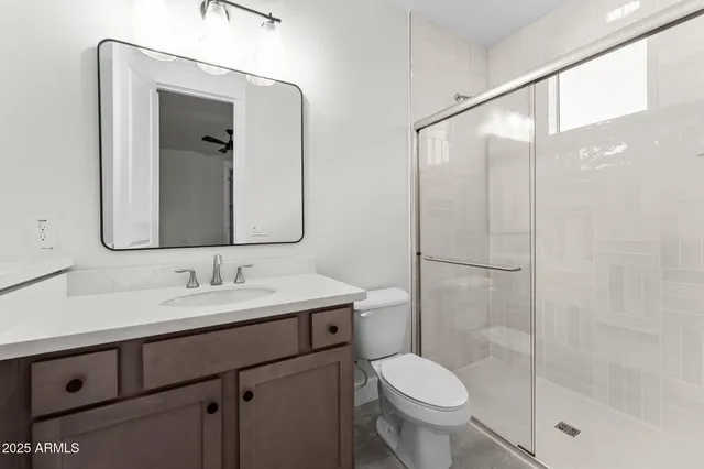 a front view of a house with yard and garage