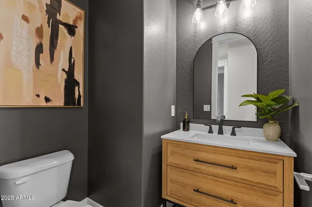 an aerial view of residential houses with city view