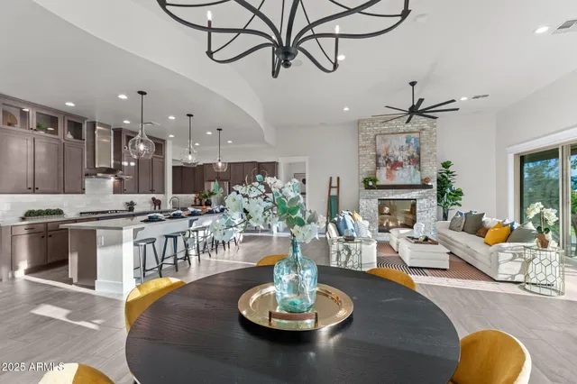 a kitchen with stainless steel appliances a sink stove and cabinets