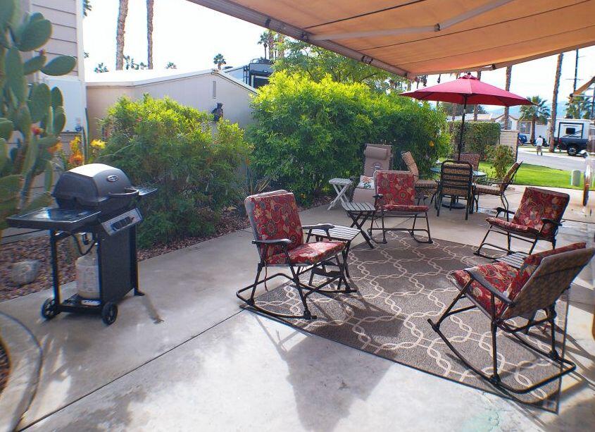 84136 Ave 44, Unit 587 Indio, CA 92203 - Photo 12 of 36 a view of a chairs and table in patio