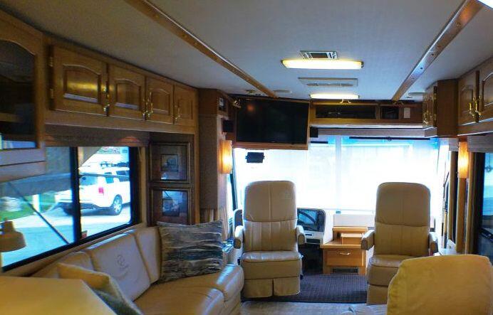 84136 Ave 44, Unit 587 Indio, CA 92203 - Photo 16 of 36 a living room with furniture and a flat screen tv