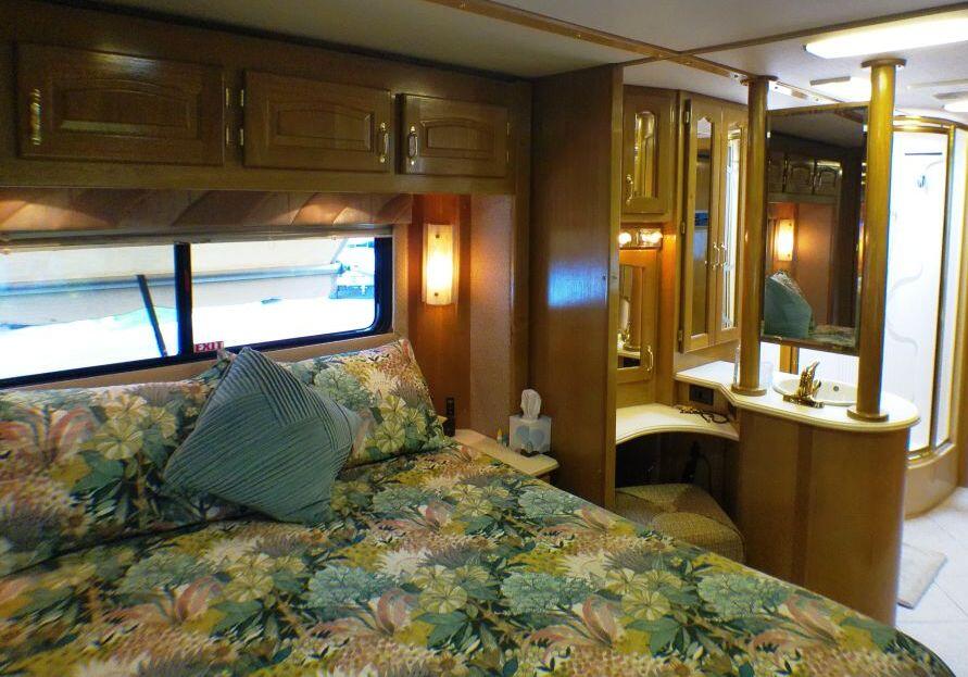 84136 Ave 44, Unit 587 Indio, CA 92203 - Photo 31 of 36 a bedroom with a bed and a dresser